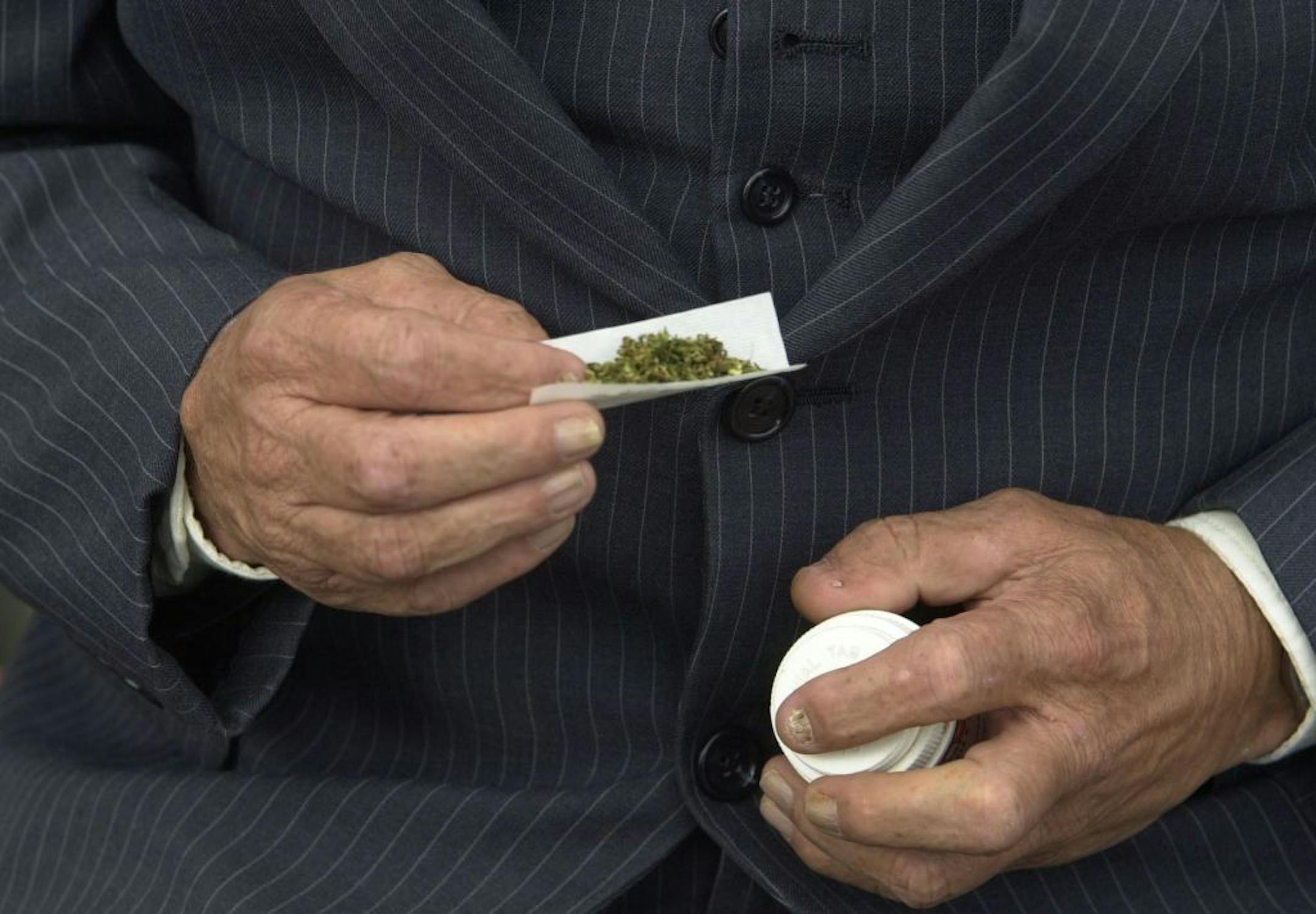 George McMahon rolls a marijuana cigarettes during a break in a St. Paul , Mn., conference held Friday, April 6, 2001. McMahon smoked outside of the Minnesota Department of Health Office in St Paul, Mn. where the event was held. (AP Photo/Richard Sennott/ Star Tribune)