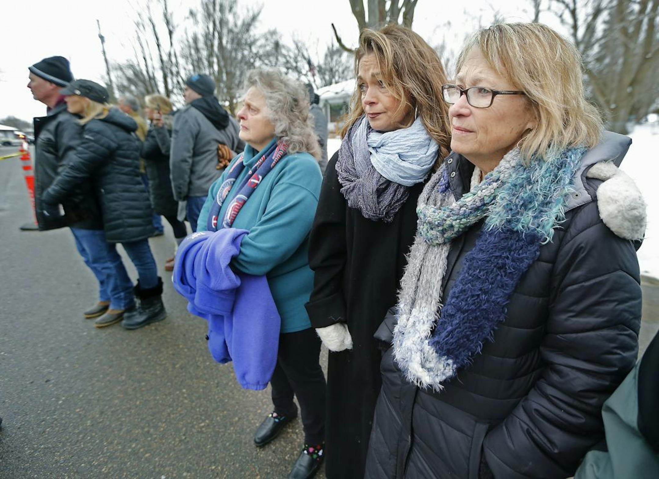 Patty Wetterling, right, was comforted as she and a group of supporters watched a crew demolish a small house that once belonged to Danny Heinrich, Jacob Wetterling's killer, on Friday.