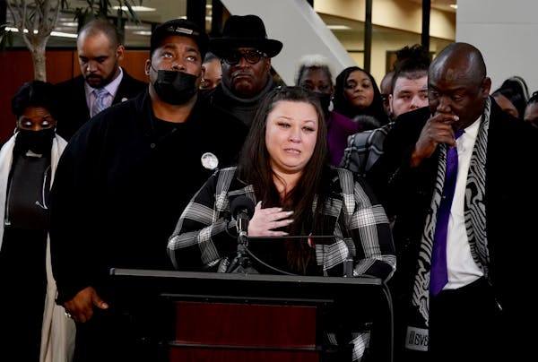 Katie Wright, Daunte Wright's mother, surrounded by family and friends, spoke to the press after the sentencing of former police officer Kim Potter. P