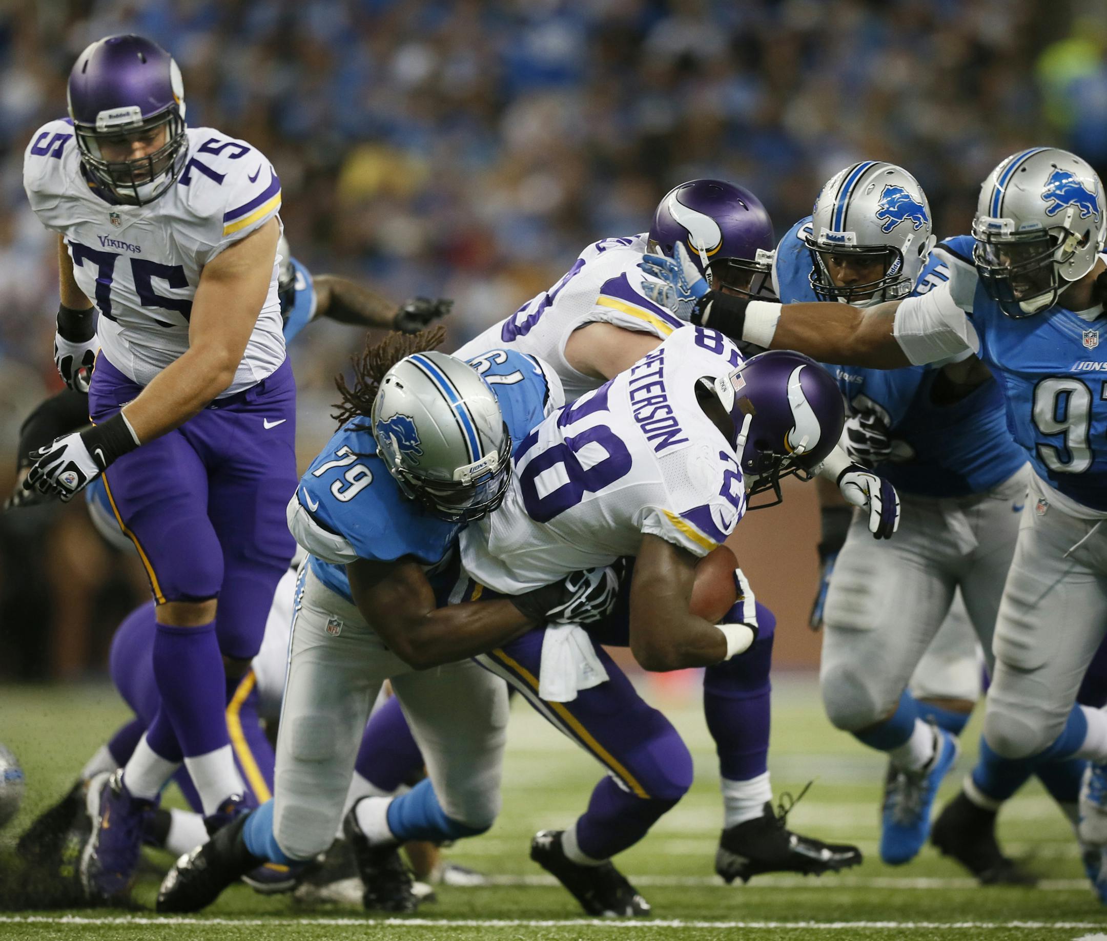 Despite starting out strong with a 77 yard run on his first possetion of the game, Adrian Peterson got stopped for the rest of the game. Here, he is stuffed for a loss in the 3rd quarter. ] Minnesota Vikings and Detroit Lions - Ford Field BRIAN PETERSON ‚Ä¢ brianp@startribune.com Detroit MI - 09/08//2013