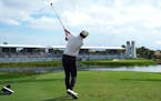 Austin Eckroat hits from the 17th tee during the final round of the Cognizant Classic in Palm Beach Gardens, Fla., on Monday. Eckroat got the first vi