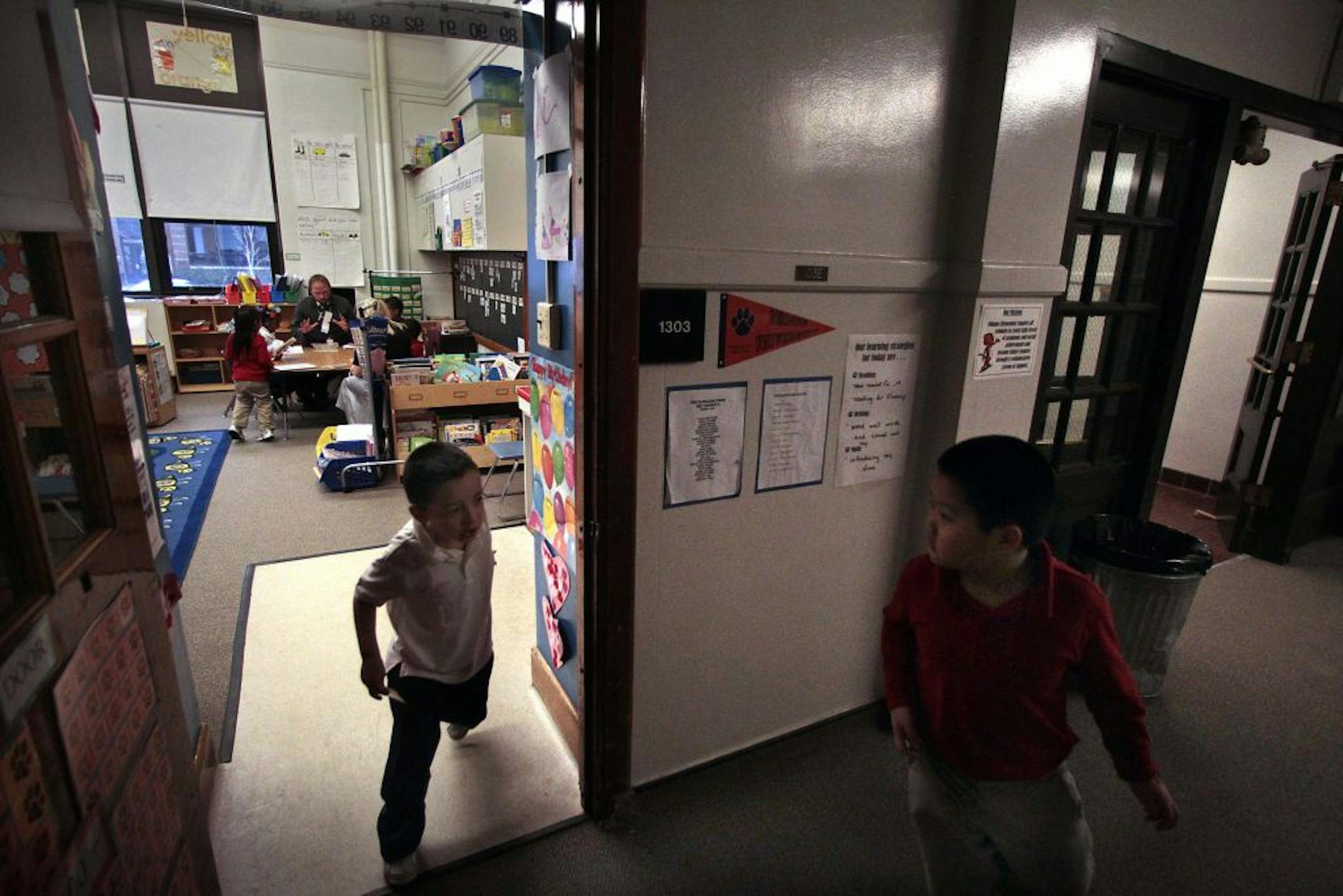 Kindergarten teacher Matt Shimon taught reading to his students as Sarah Johnson evaluated his performance. For part of the lesson, students had broken down into smaller reading groups.