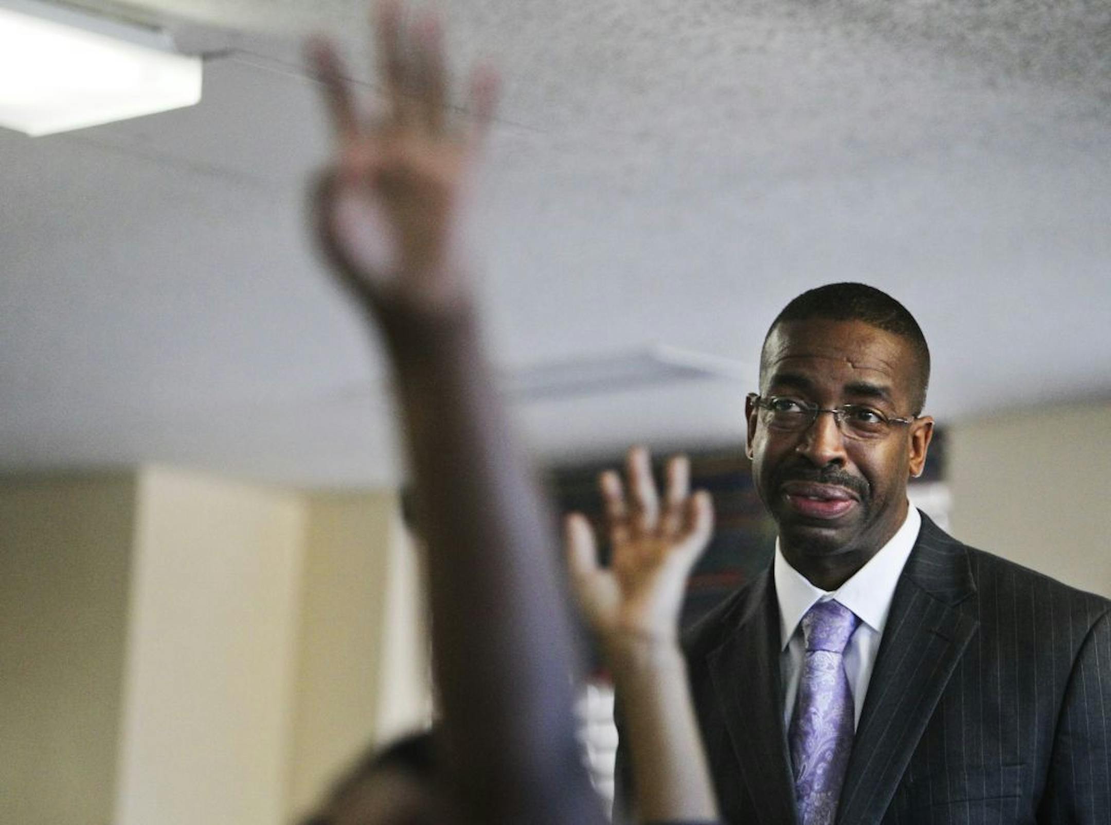 Harvest Prep and Best Academy founder and principal Eric Mahmoud watched as Best Academy 4th graders worked on math Thursday, Dec. 8, 2011 in Minneapolis.