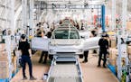 The number of electric vehicles registered in Minnesota has nearly tripled since 2017. In this photo, Tesla Model 3’s are assembled in California. 