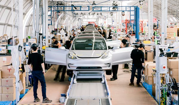 The number of electric vehicles registered in Minnesota has nearly tripled since 2017. In this photo, Tesla Model 3’s are assembled in California. 