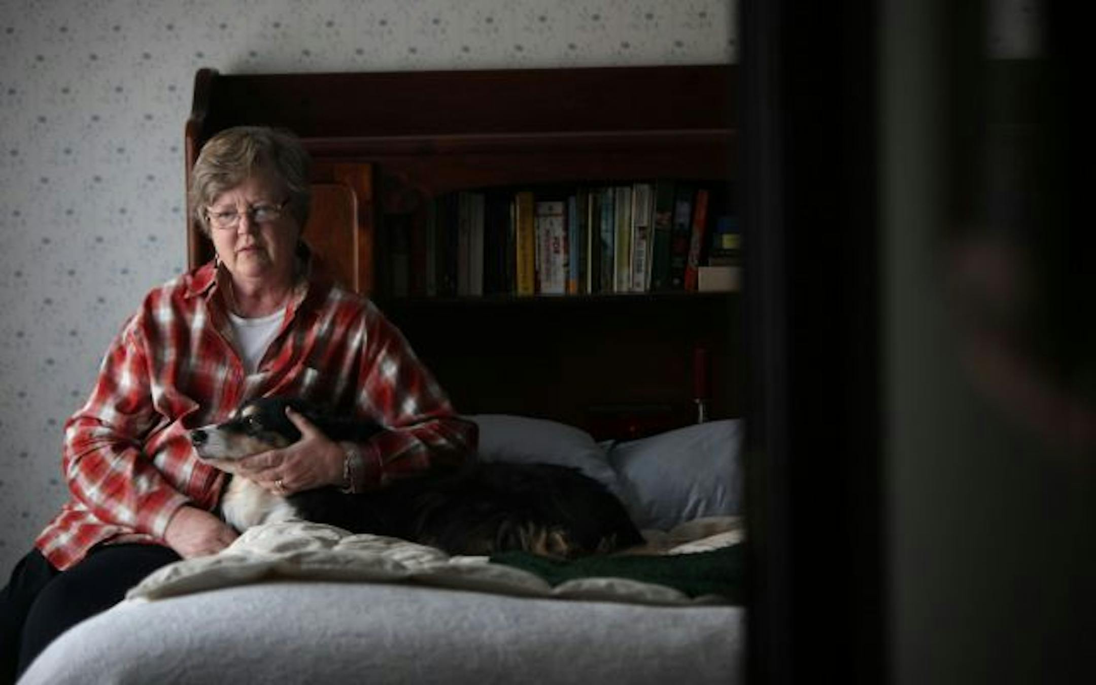 Retired nurse Molly Sullivan, of Maple Grove, said that with her premiums rising it's hard to pay for food for Daisy, her Australian sheepdog and "the life of the house." Sullivan was among older Minnesotans in St. Paul on Thursday to explain why the AARP is backing of a bill in the U.S. House to overhaul health care.