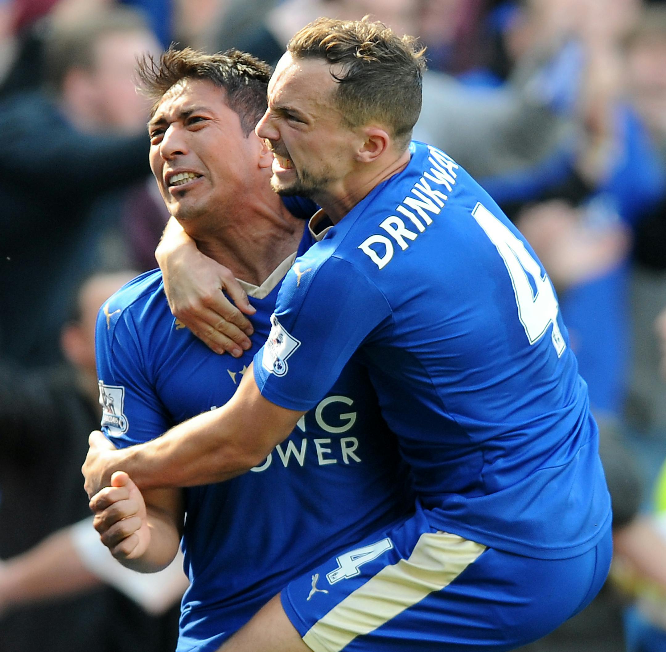 FILE - In this Sunday, April 17, 2016 file photo Leicester City's Leonardo Ulloa celebrates with teammates Leicester City's Danny Drinkwater after scoring a last minute penalty during the English Premier League soccer match between Leicester City and West Ham United at the King Power Stadium in Leicester, England. Bought from second-division team Brighton in 2014, Ulloa goal tally of 13 helped Leicester retain its Premier League status last season. His role has been reduced with the arrival of O