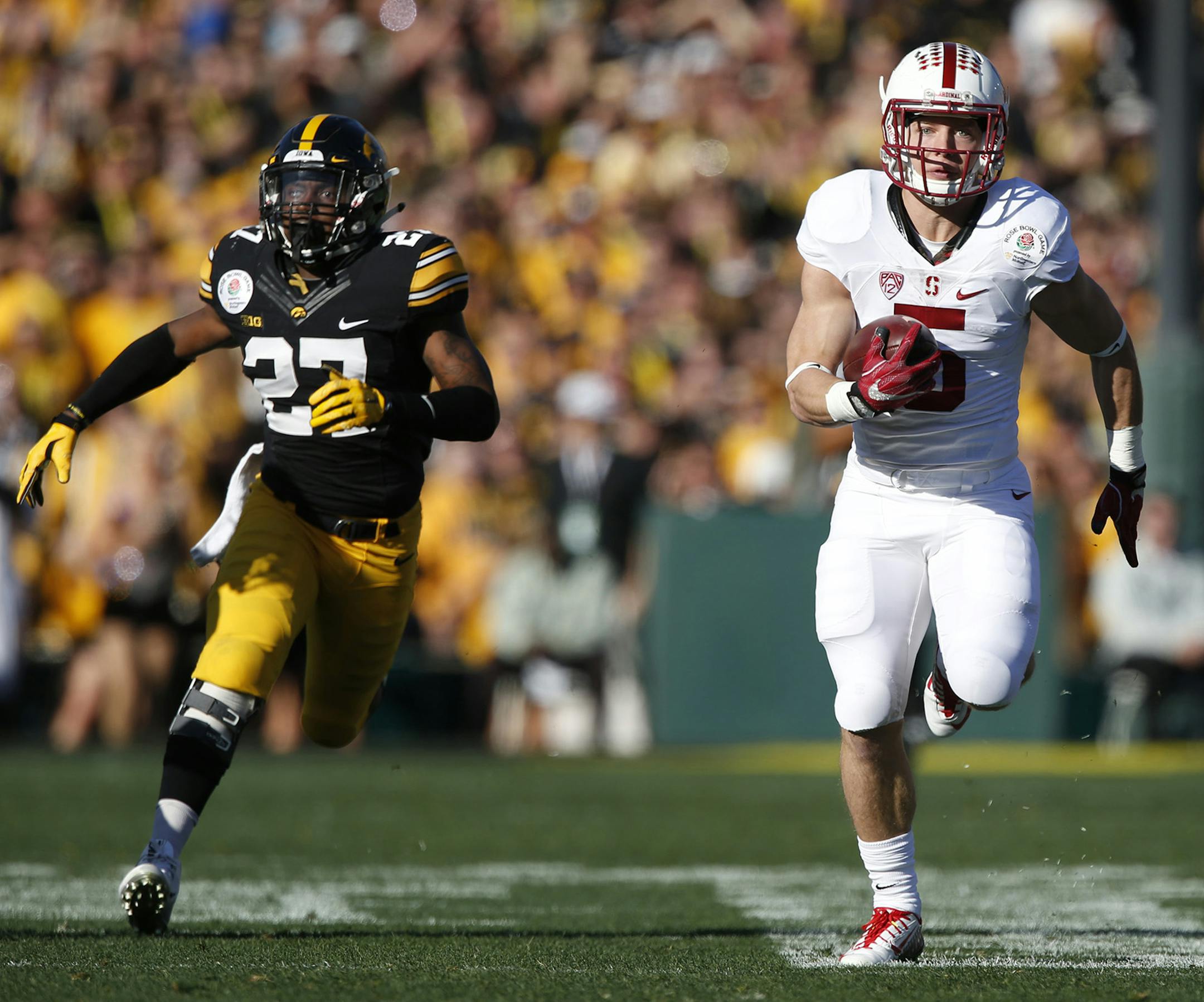Stanford running back Christian McCaffrey (5) outruns the Iowa defense for a 75-yard touchdown reception on the first play of the game in the 102nd Rose Bowl on Friday, Jan. 1, 2016, at the Rose Bowl in Pasadena, Calif. (Robert Gauthier/Los Angeles Times/TNS) ORG XMIT: 1178813