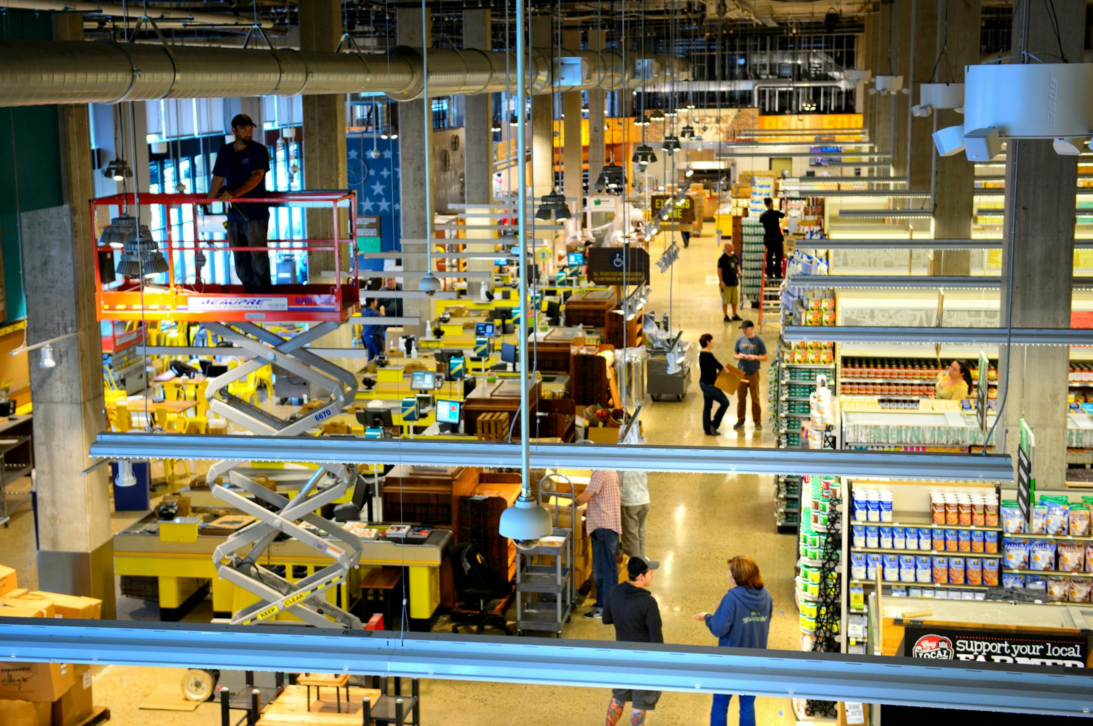 Whole Foods will open in the North Loop neighborhood of Minneapolis on September 25. Here workers readied the store for its grand opening. Thursday, September 19, 2013 ] GLEN STUBBE * gstubbe@startribune.com