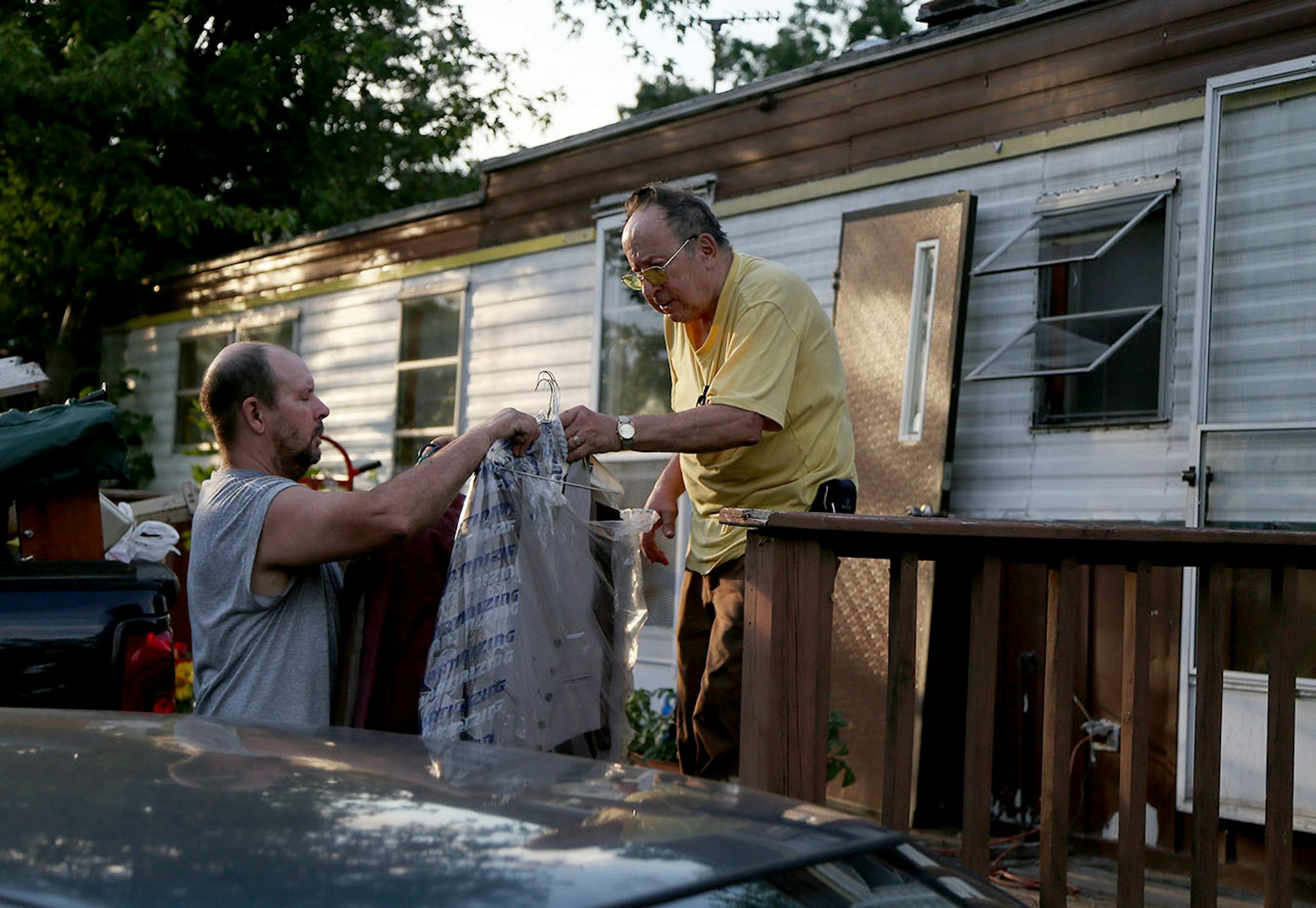 Jerry Wonsewicz, 80, right, gets help moving his belongings from his one Gary Wonsewicz, 57, both residents of Lowry Grove mobile home park Friday, June 30, 2017, in St. Anthony, MN. Lowry Grove closed it's gate and all residents had to be gone by 12 midnight on July 1, the space slated to be redeveloped into multiple-family housing.