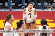 Minnesota outside Taylor Landfair (12) reacts after outside Arica Davis (20) blocked a spike for a point in the third set Friday, Nov. 10, 2023, at Ma