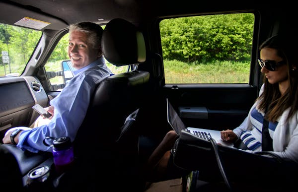 Between campaign stops, Scott Honour made phone calls and checked email from the front seat of his Ford F-350 truck which he had converted to run on n