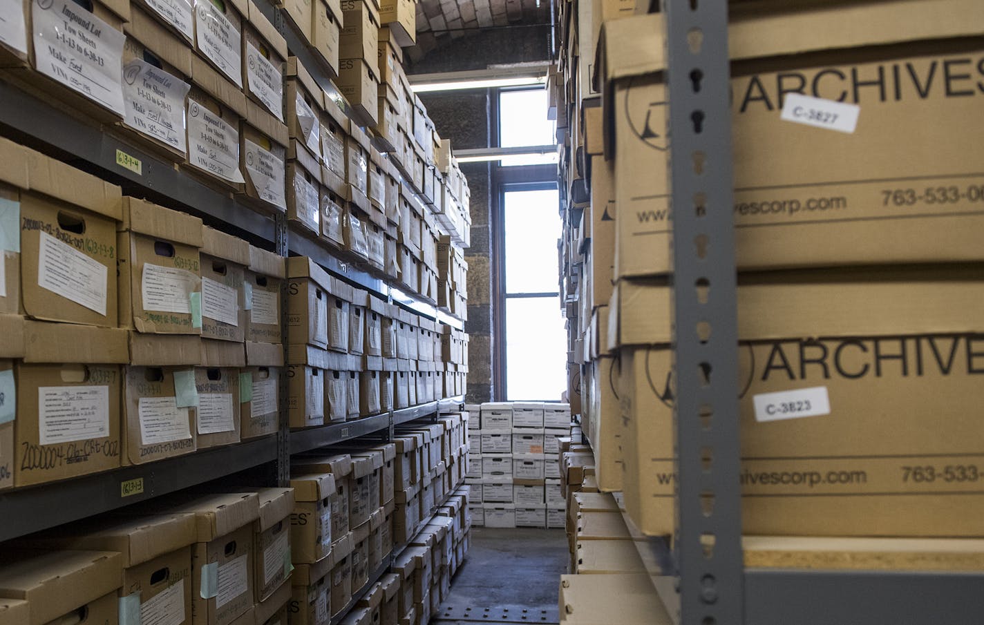 Boxes of archived files sit in boxes in one of the upper levels of the building. ] Isaac Hale &#xef; isaac.hale@startribune.com Teresa Baker, of the Municipal Building Commission, gave a tour of the oddities and interesting facets of the Minneapolis City Council building on Monday, June 27, 2016.