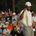Tiger Woods pumps his fist after a birdie on the 18th hole during the second round of the Masters golf tournament Friday, April 8, 2011, in Augusta, G