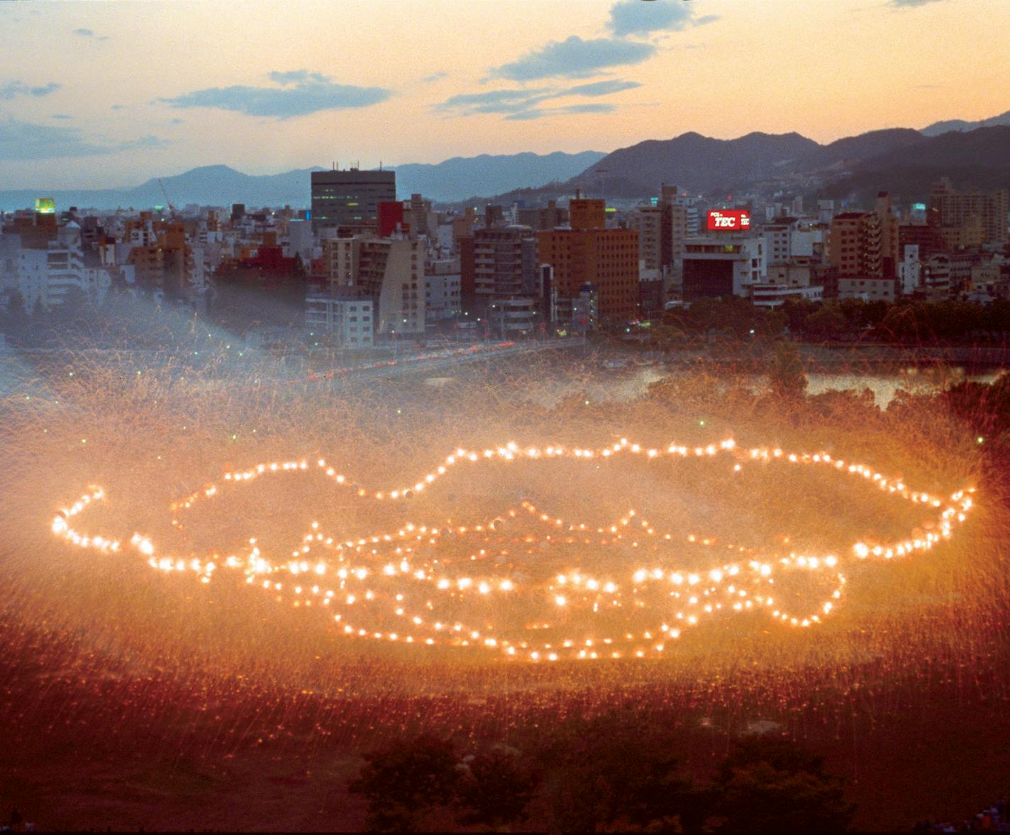 Sky Ladder scheduled to stream on Netflix. Shown: The Earth Has Its Black Hole Too: Project for Extraterrestrials No. 16, realized at Hiroshima Central Park near the A-Bomb Dome, October 1, 1994. Photo: Kunio Oshima, Courtesy of Cai Studio/Netflix