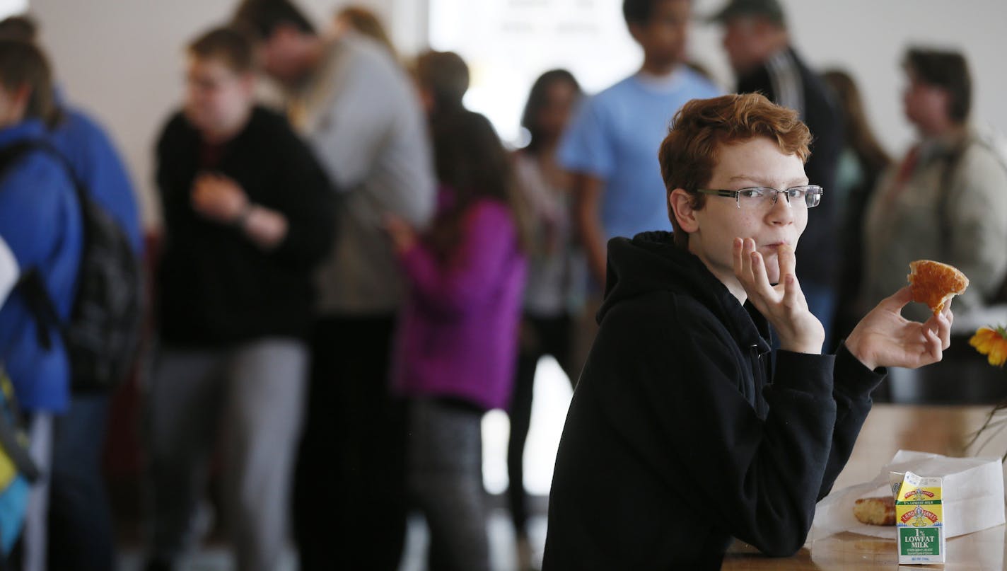 Devin Irwin 13, enjoyed his donut Tuesday March 25, 2014 at Hans Bakery in Anoka, Minnesota ]JERRY HOLT jerry.holt@startribune.com