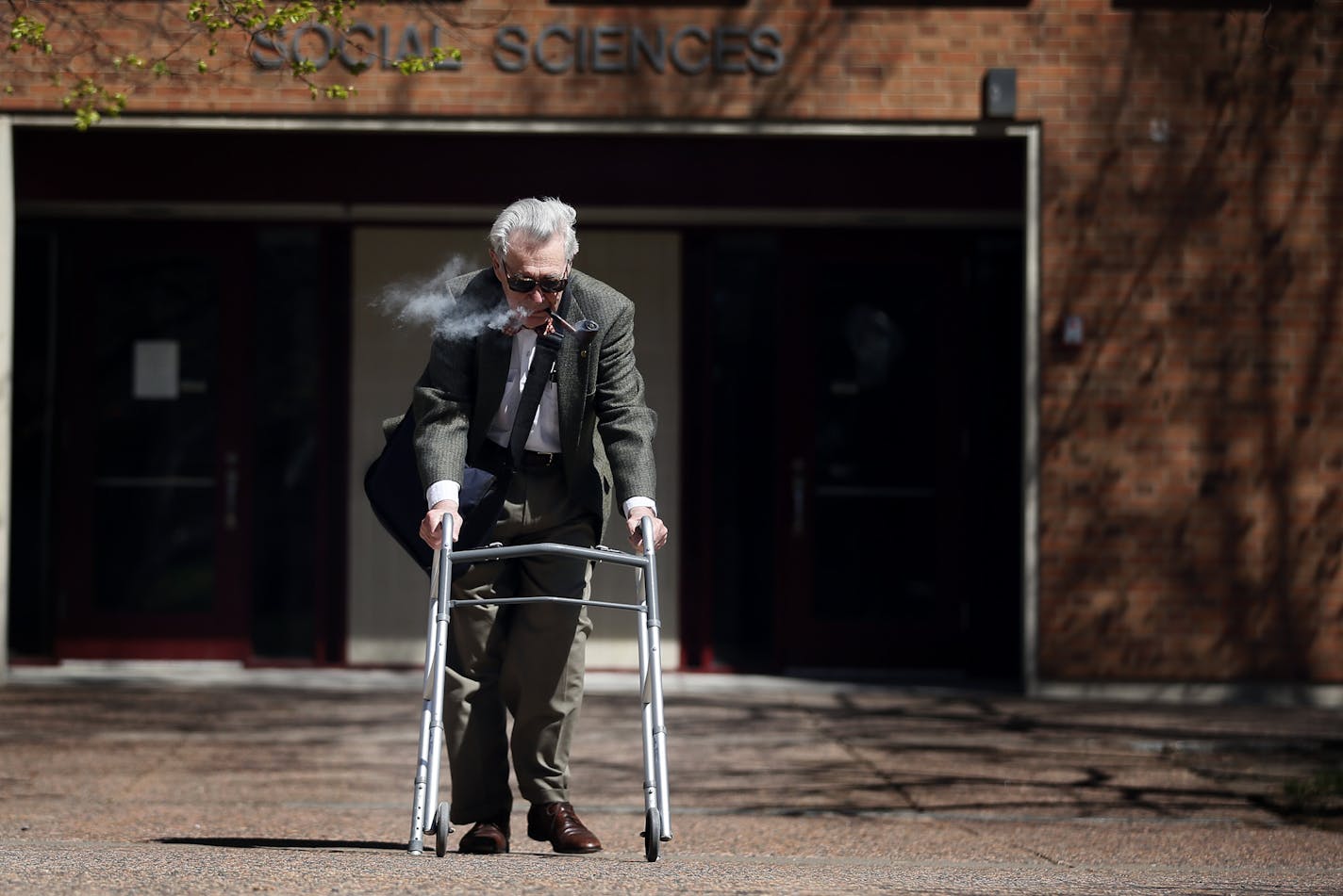 Professor John Fraser Hart enjoyed smoking his pipe after teaching a class at the University of Minnesota Wednesday April 29, 2015 in Minneapolis, MN. Professor John Fraser Hart 91 a Social Sciences teacher is the oldest professor that the University of Minnesota has and he has decided to retire.] Jerry Holt/ Jerry.Holt@Startribune.com