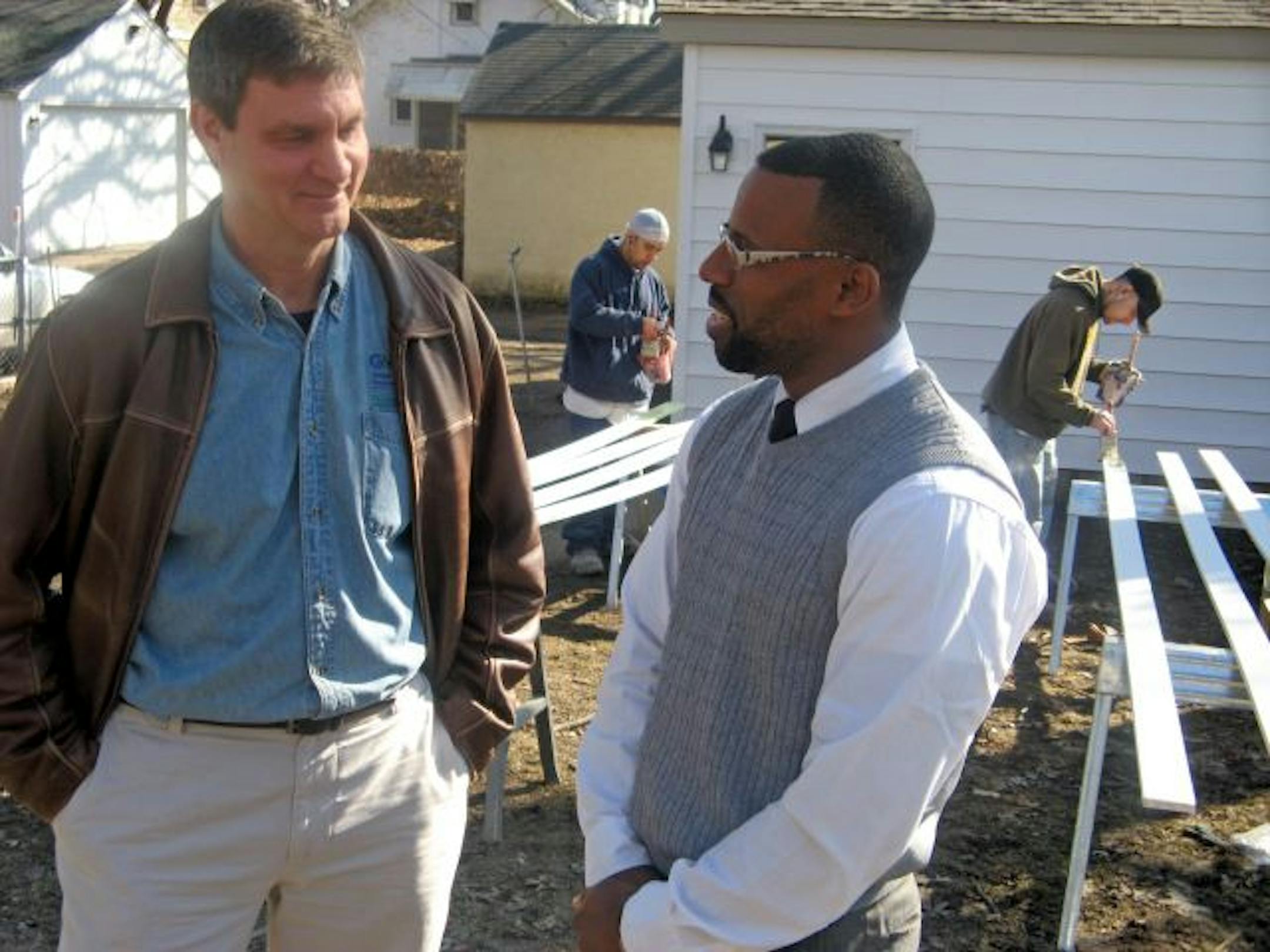 Bill Buelow, left, director of construction with the Greater Metropolitan Housing Corp, chatted with Henry Ford, a North Minneapolis general contractor who has gutted and refurbished six foreclosed houses.