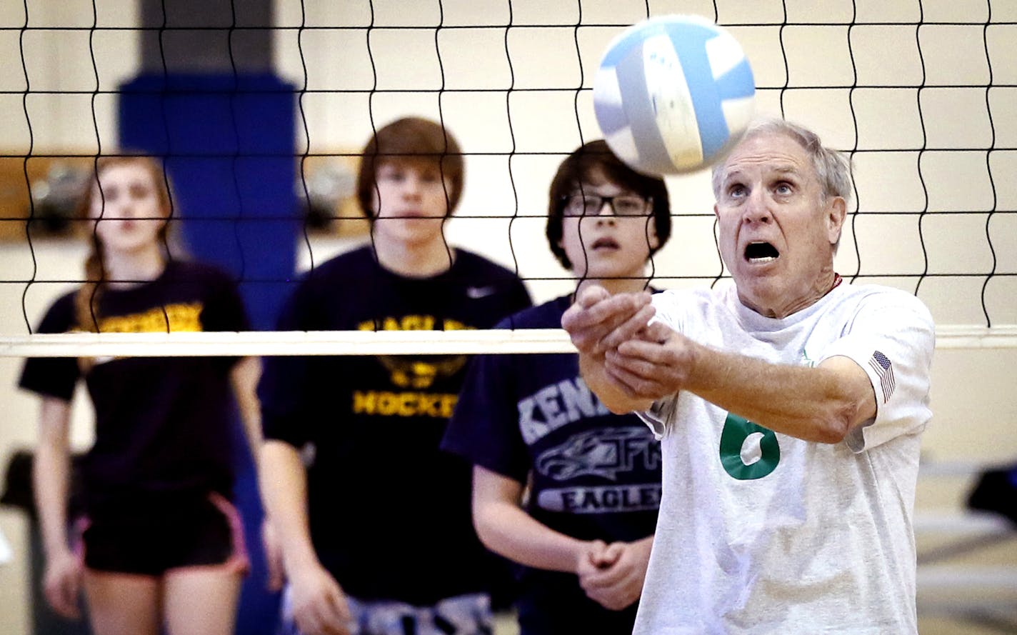 Bob Wandberg tried to hit the ball over the net during a volley ball game with Jefferson High students . A group of senior citizens who call themselves "Born Again Jocks" played volleyball with sophomore students at Kennedy High school Monday March 2, 2015 in Bloomington, Minnesota. The team includes seniors who have been selected to play in the upcoming Senior Olympics this summer.] Jerry Holt/ Jerry.Holt@Startribune.com