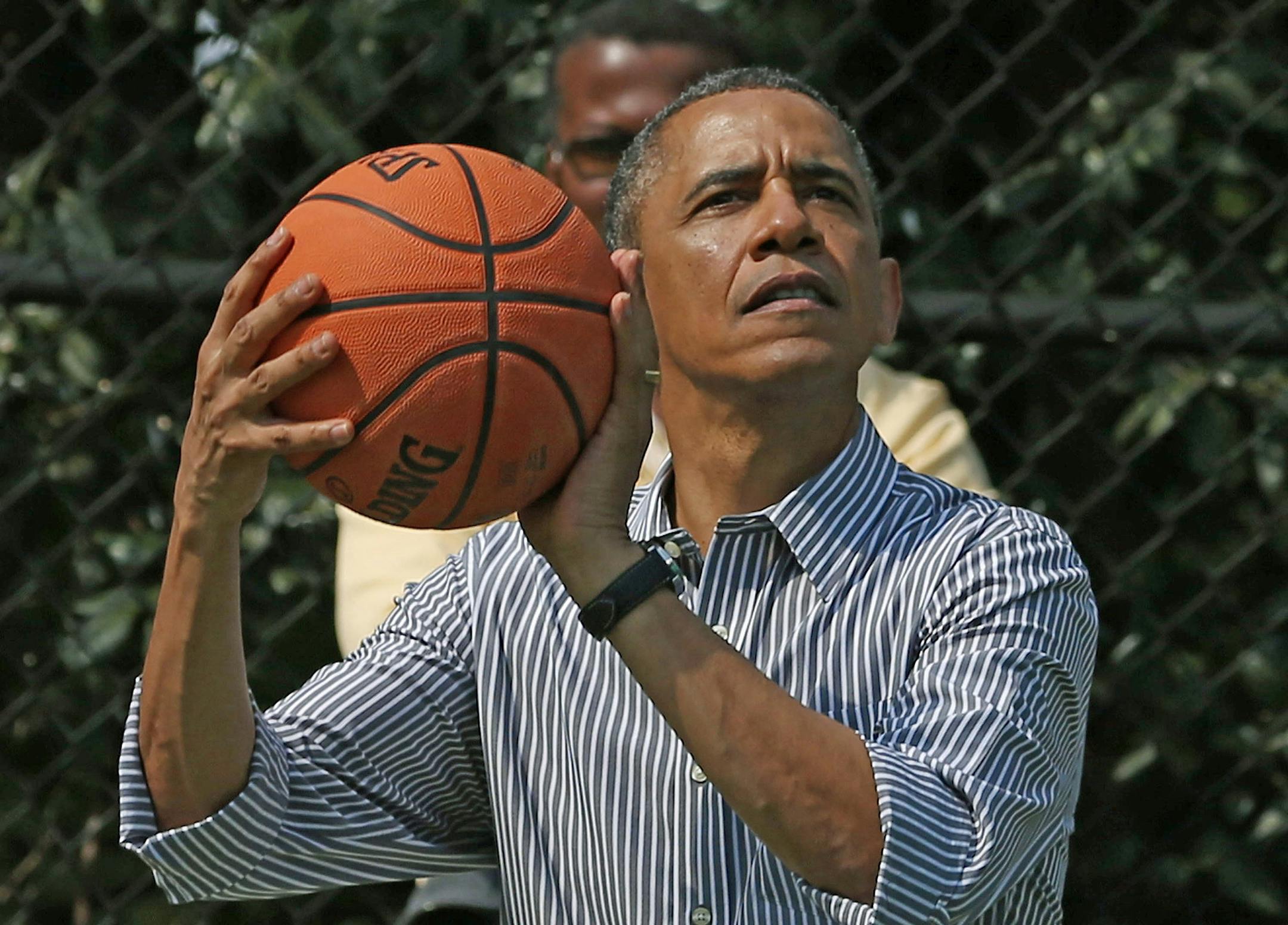 United States President Barack Obama plays basketball during the annual Easter Egg Roll on the White House tennis court April 1, 2013 in Washington, DC. Thousands of people are expected to attend the 134-year-old tradition of rolling colored eggs down the White House lawn that was started by President Rutherford B. Hayes in 1878. .Credit: Mark Wilson / Pool via CNP Photo by: Mark Wilson/picture-alliance/dpa/AP Images
