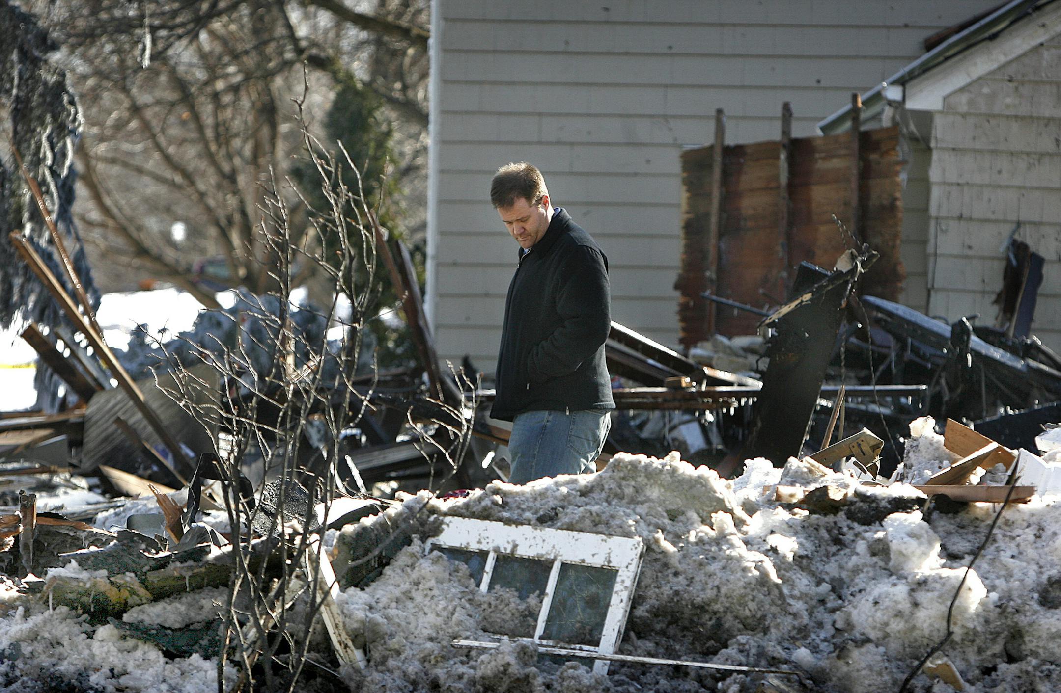 JIM GEHRZ • jgehrz@startribune.comEdina/February 24, 2010/9:45 AM ]Matthew Augustson looked over the devastation left when a natural gas explosion destroyed his home at 5000 Arden Avenue in Edina Tuesday afternoon. Accompanied by Accompanied by the Edina fire chief, Matthew and Jeanette Ausustson returned to the home on Wednesday to inspect the site. The family, including their two children, ages 5 and 2, were not home at the time of the explosion. A family pet, a black lab, was inside th