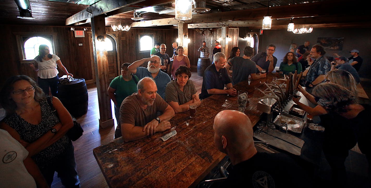 Patrons enjoyed the tastes of a variety of beers at the HammerHeart Brewing Company tap room. ] (JIM GEHRZ/STAR TRIBUNE) / August 10, 2013, Lino Lakes, MN &#x2013; BACKGROUND INFORMATION- The HammerHeart Brewing Company opened recently in Lino Lakes. According to its two founders, the brewery is built in the honor and recognition of the old Nordic and Celtic cultures.