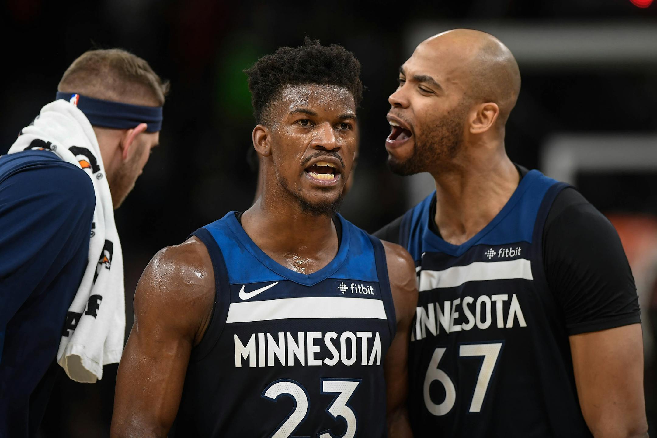 The Minnesota Timberwolves' Taj Gibson (67) and Jimmy Butler (23) react after a Butler basket forced a Denver Nuggets timeout in overtime on Wednesday, Dec. 27, 2017, at Target Center in Minneapolis. The Timberwolves won, 128-125, in OT. (Aaron Lavinsky/Minneapolis Star Tribune/TNS) ORG XMIT: 1219647