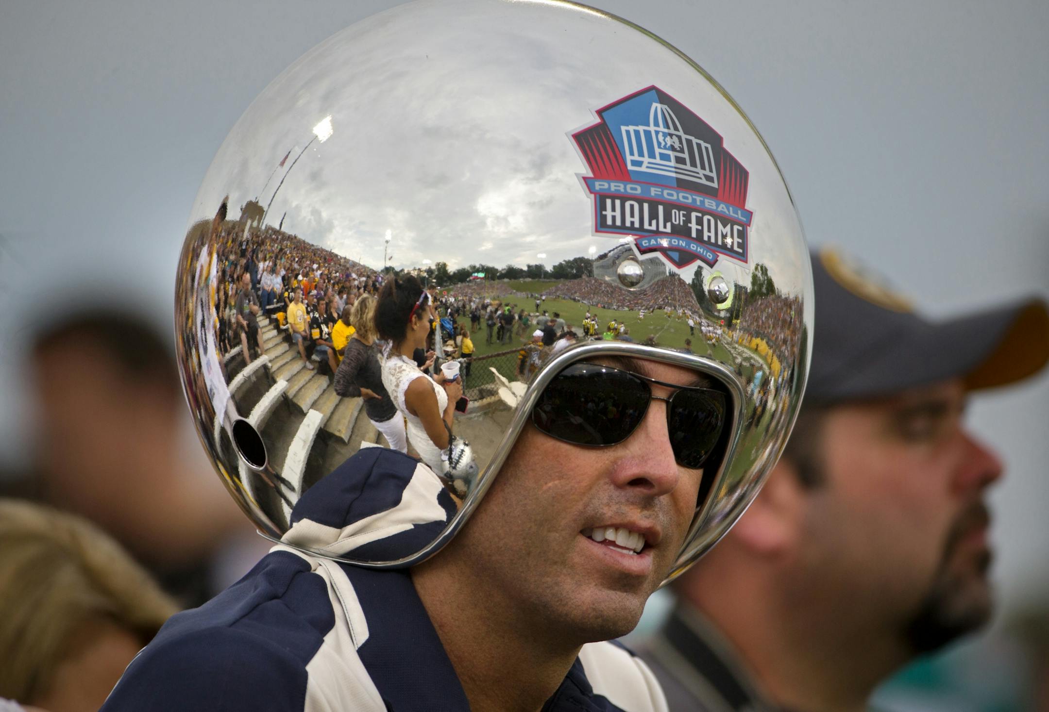 Tom Benson Hall of Fame Stadium is reflected in the Steeler Ball helmet of Gregg Wilson. 1st preseason game of the season.