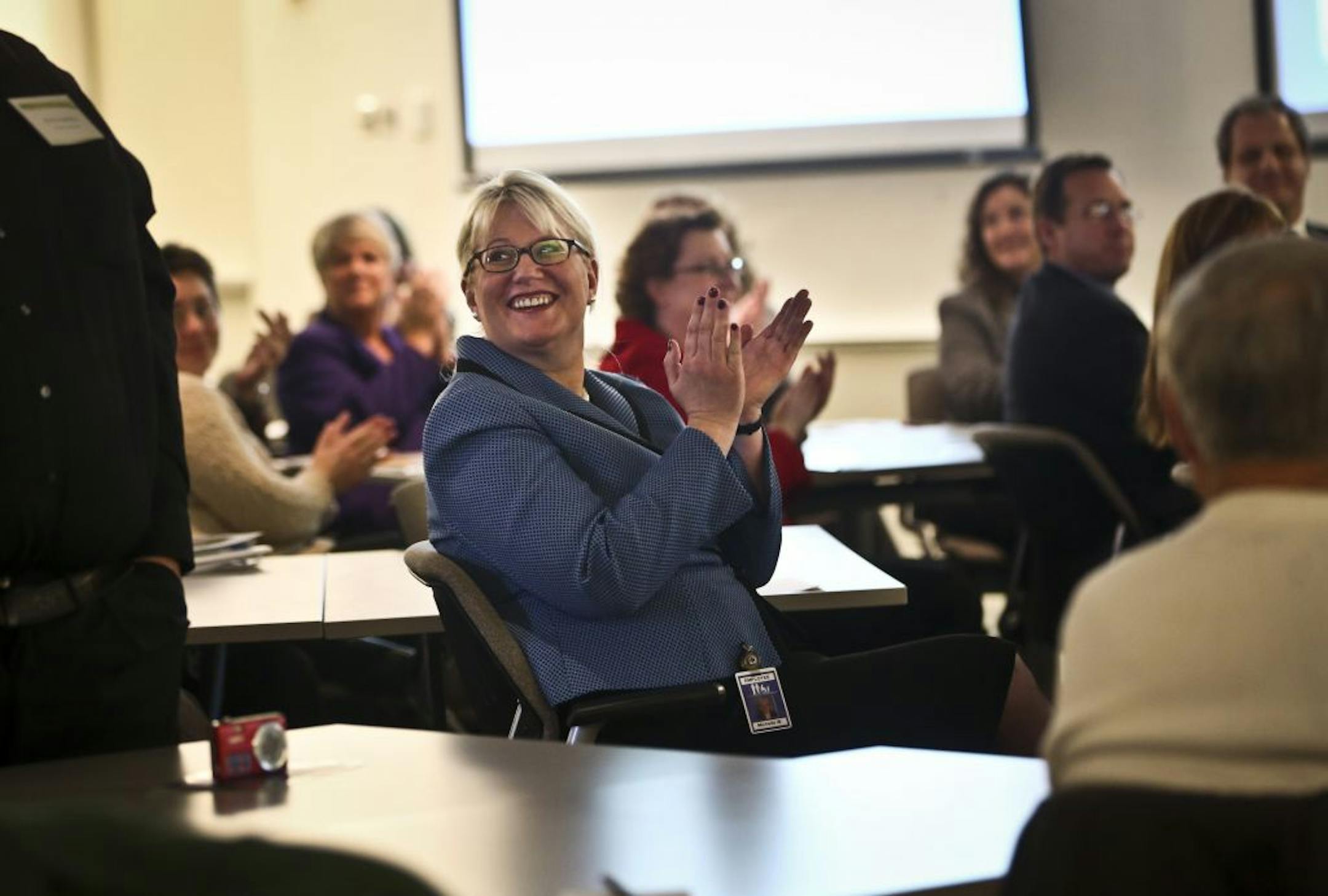Contract manager for the Department of Human Services in the manage care area Michelle Wernimont clapped as DHS commissioner Lucinda Jesson awarded the Commissioner's Circle of Excellence Awards that honors seven organizations that have made outstanding contributions to human services program clients in 2012, during a ceremony in St. Paul, MInn., on Monday, December 3, 2012. Wernimont said she came to the ceremony for that "wow" moment. "It's so darn exciting just to see this work that's being d