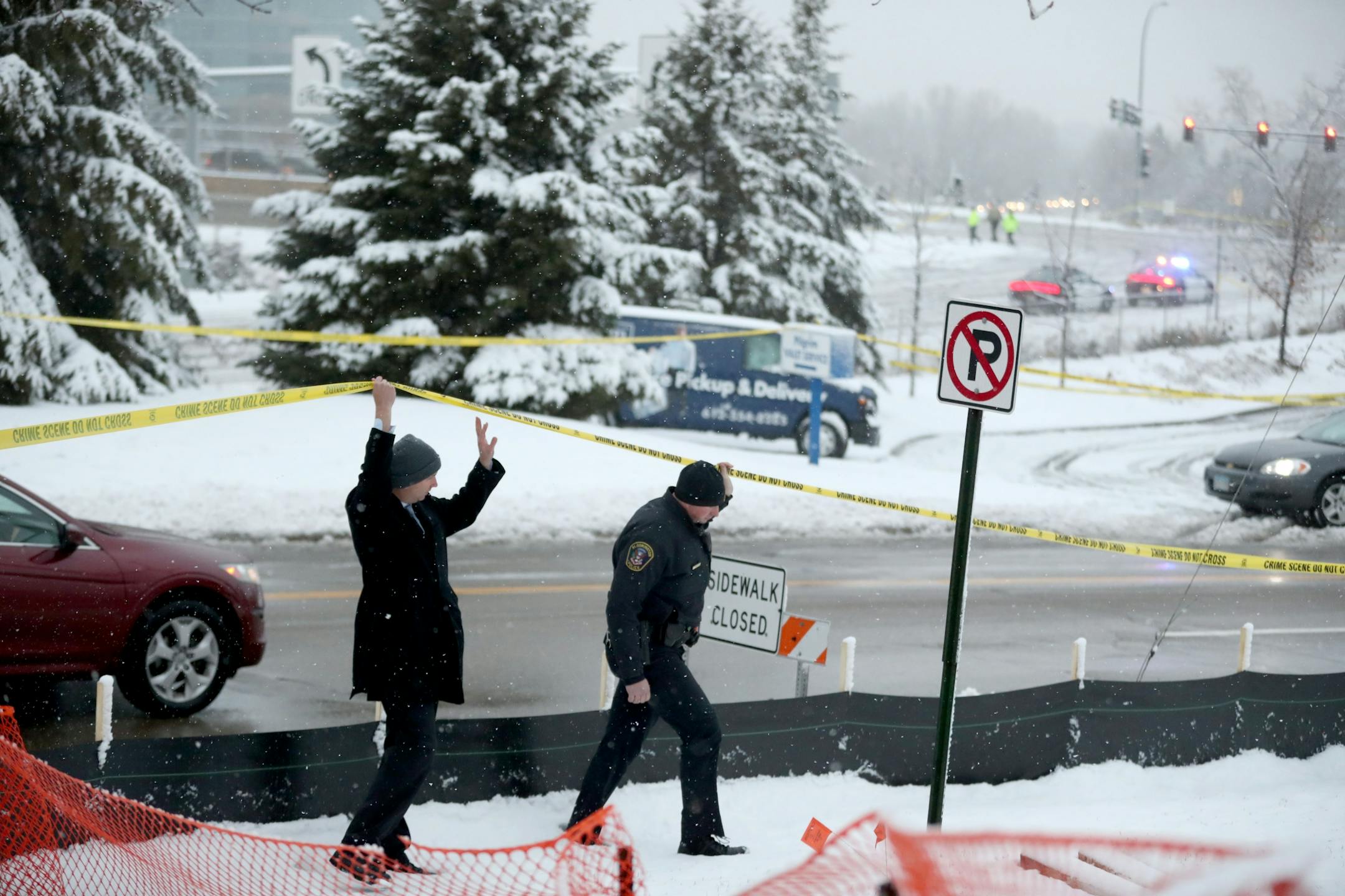Authorities investigate the scene where an officer-involved shooting occurred early Wednesday at Bren Road and Highway 169 in Edina.