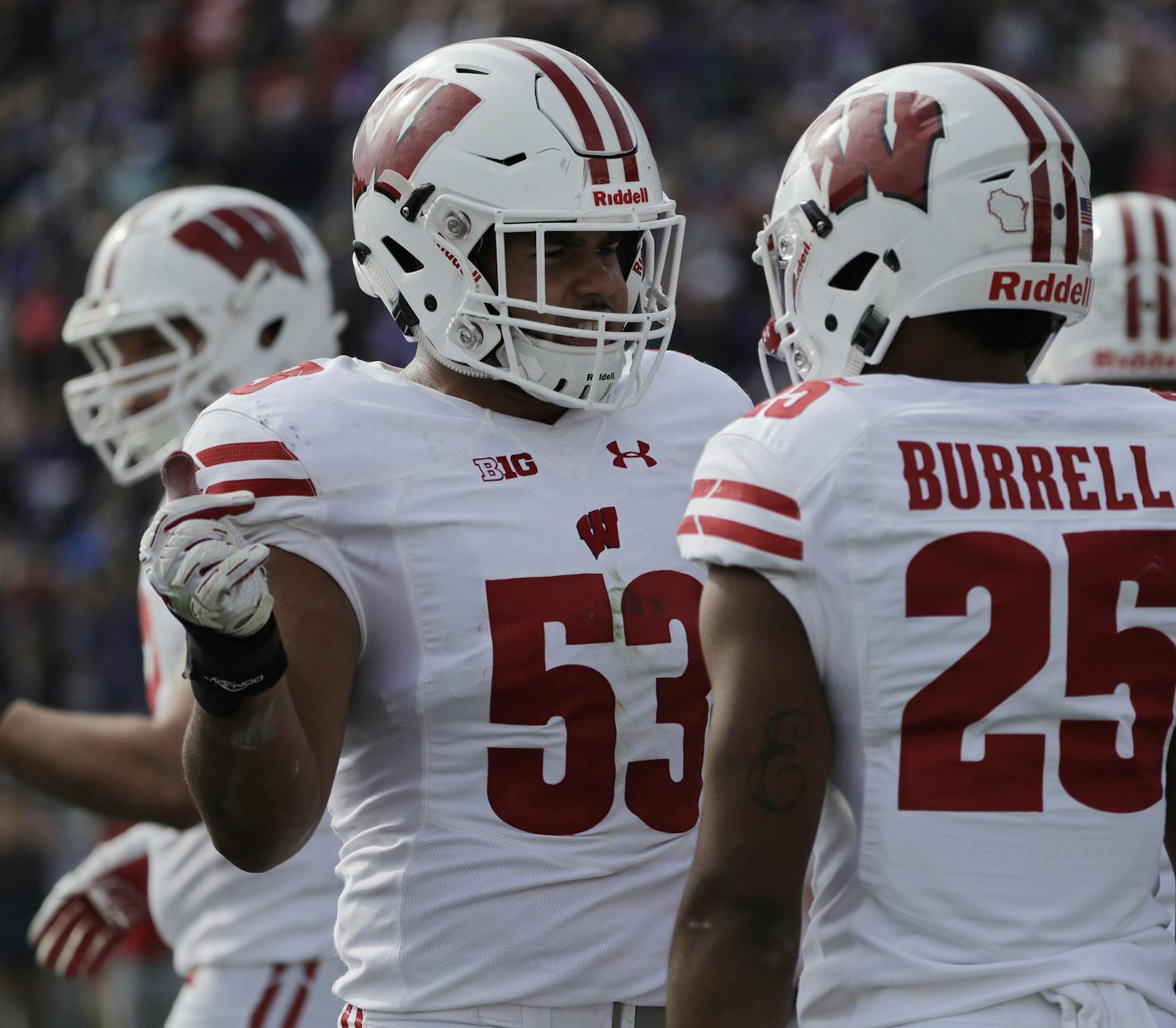 Wisconsin linebacker T.J. Edwards (53) talks with safety Eric Burrell (25) during the first half of an NCAA college football game against Northwestern in Evanston, Ill., Saturday, Oct. 27, 2018. (AP Photo/Nam Y. Huh)