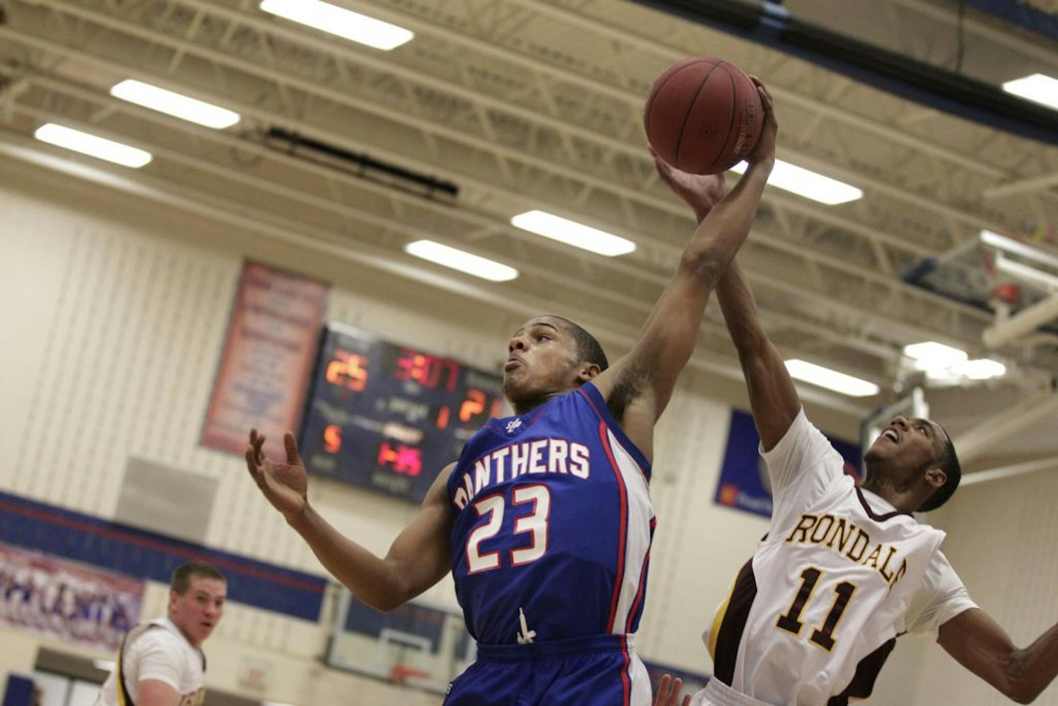 Spring Lake Park senior forward Sean Scott, left, battling Irondale's Kevin Poster last week, sought out former Panthers players for advice on how to be a good leader.