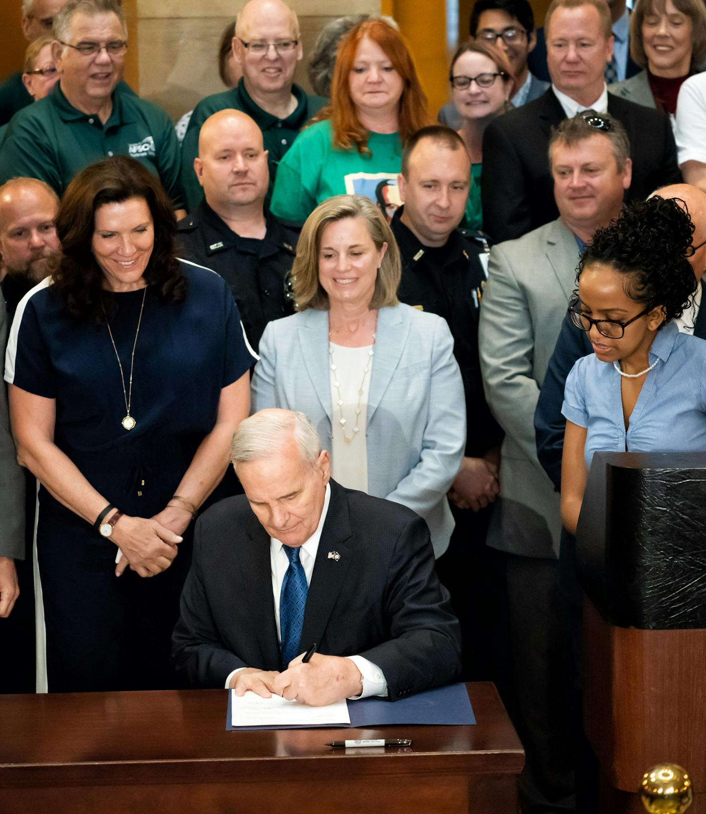 Surrounded by commissioners, legislators, workers, and retirees in the Capitol Rotunda, Gov. Mark Dayton signed the pension bill into law Thursday. The legislation reduces the state's pension fund liabilities and alleviates public workers' and retirees' fears that the retirement fund could eventually run short, which would hurt hundreds of thousands of Minnesotans. ] GLEN STUBBE &#xef; glen.stubbe@startribune.com Thursday, May 31, 2018 Surrounded by commissioners, legislators, workers, and retir