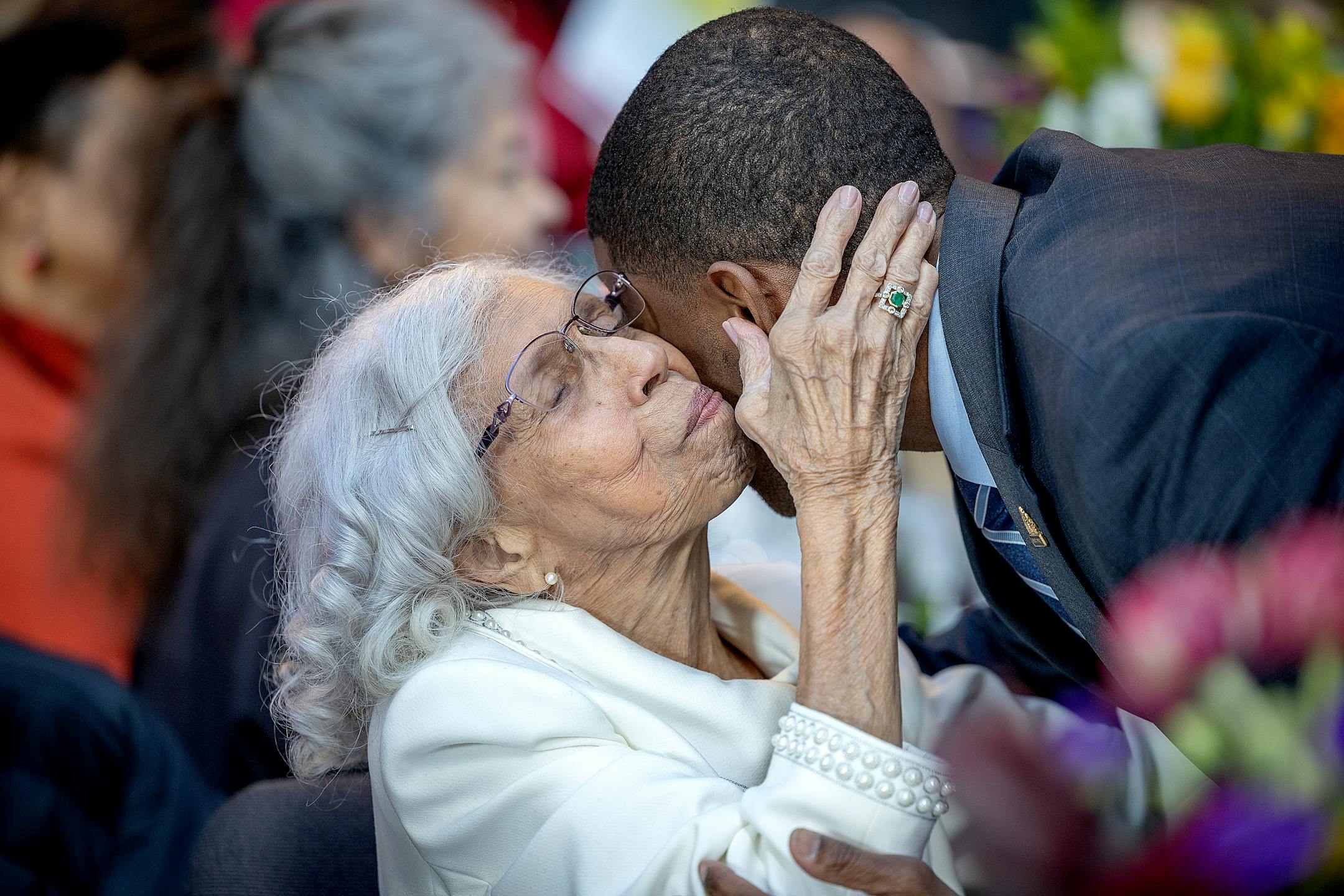 Josie R. Johnson embraces St. Paul Mayor Melvin Carter as he greets her at a ceremony honoring her in Minneapolis.