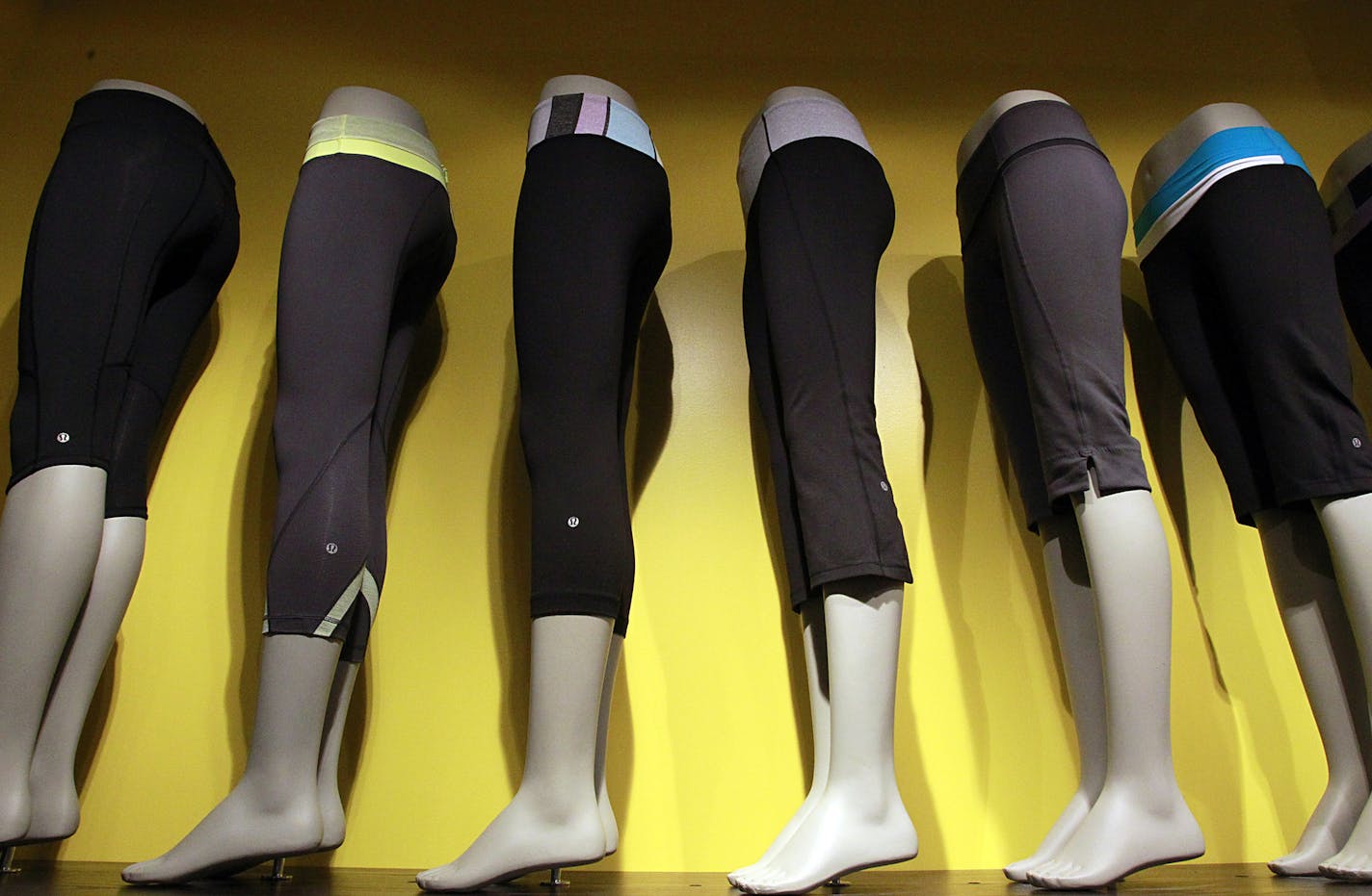 A line of sweatpants is displayed at Lululemon at a store at the South Coast Plaza in Costa Mesa as seen June 19, 2011. Lululemon Athletica Inc. announced it would be recalling thousands of black yoga pants from store shelves because of a manufacturing defect. (Luis Sinco/Los Angeles Times/MCT)