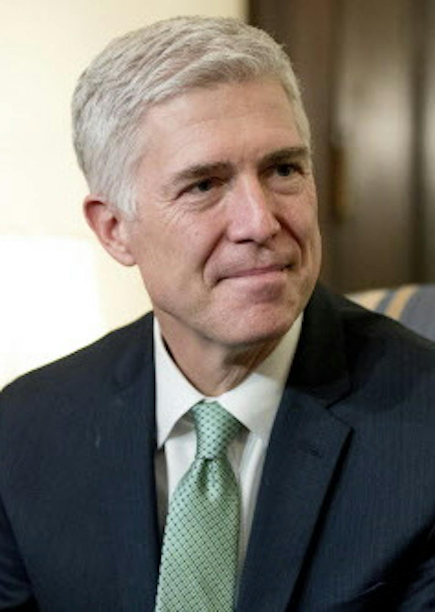 Supreme Court Justice nominee Neil Gorsuch meets with Sen. Chris Coons, D-Del. on Capitol Hill in Washington, Tuesday, Feb. 14, 2017. (AP Photo/Andrew Harnik)