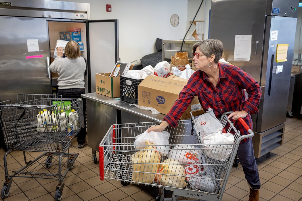 Volunteers for Keystone Community Partners packaged groceries in St. Paul in February 2023.
