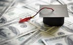 Graduation mortar board cap on one hundred dollar bills concept for the cost of a college and university education. istock photo