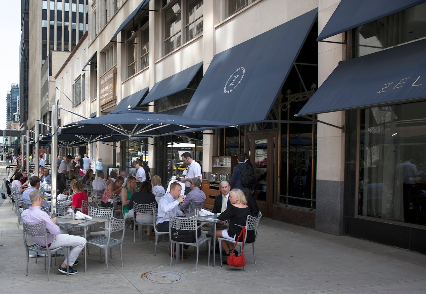 Nicollet Mall sidewalk cafes. The biggest one is the stretch of tables outside the Local, Barrio and RandleÕs, between 9th and 10th. The one thatÕs shot straight on, with the Young Quinlan building in the background, is HaskellÕs Wine Bar. The one with the blue awnings is Zelo.