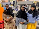 Amazon workers at the SN1 Brooklyn Park facility modeled their newly designed company hijabs. From left, Anisa Gerad, Binto Jabril and Hinda Falug.
