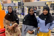 Amazon workers at the SN1 Brooklyn Park facility modeled their newly designed company hijabs. From left, Anisa Gerad, Binto Jabril and Hinda Falug.