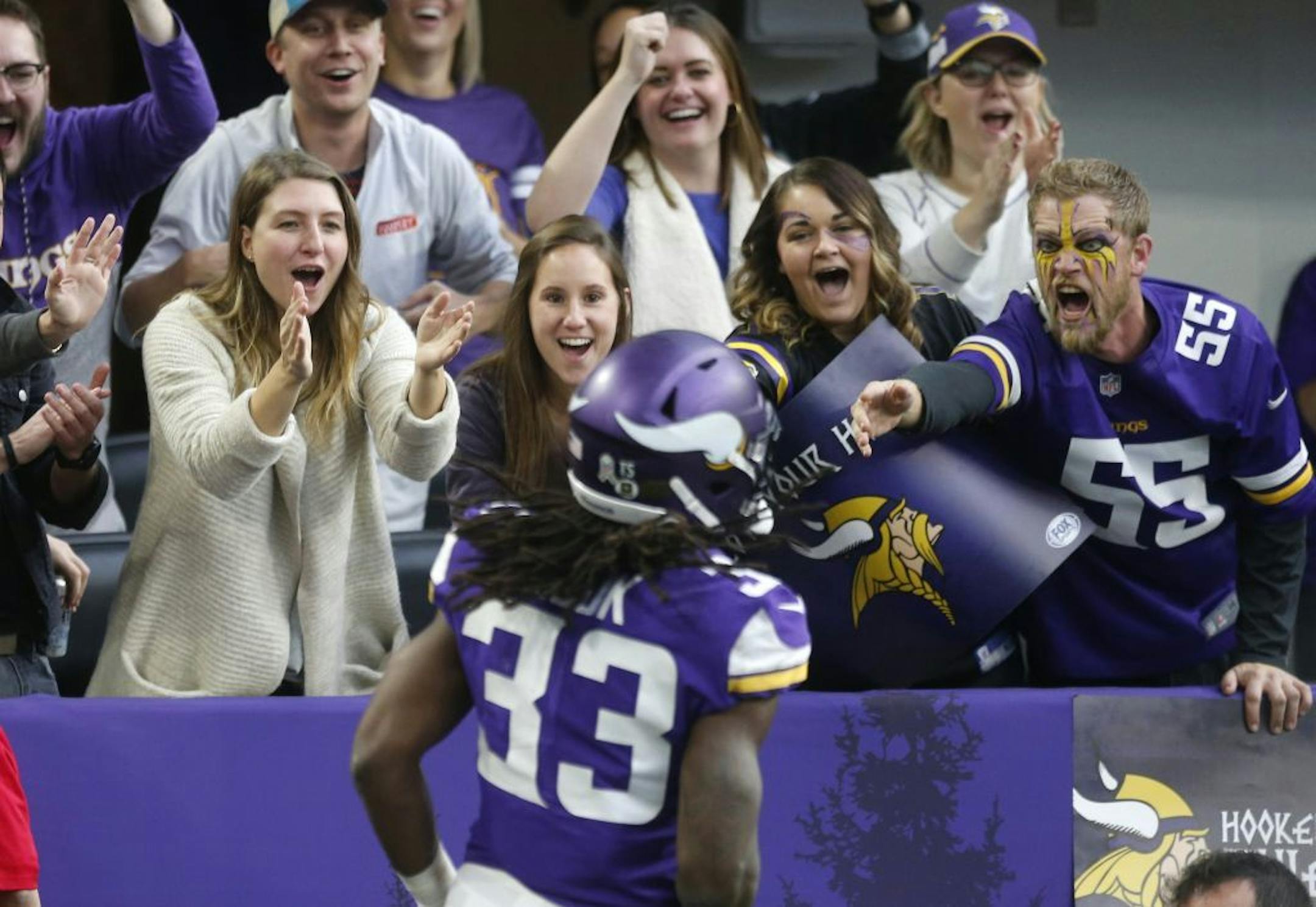 Minnesota Vikings running back Dalvin Cook (33) celebrates with fans after a 70-yard run in the first half of an NFL football game against the Detroit Lions, Sunday, Nov. 4, 2018, in Minneapolis.