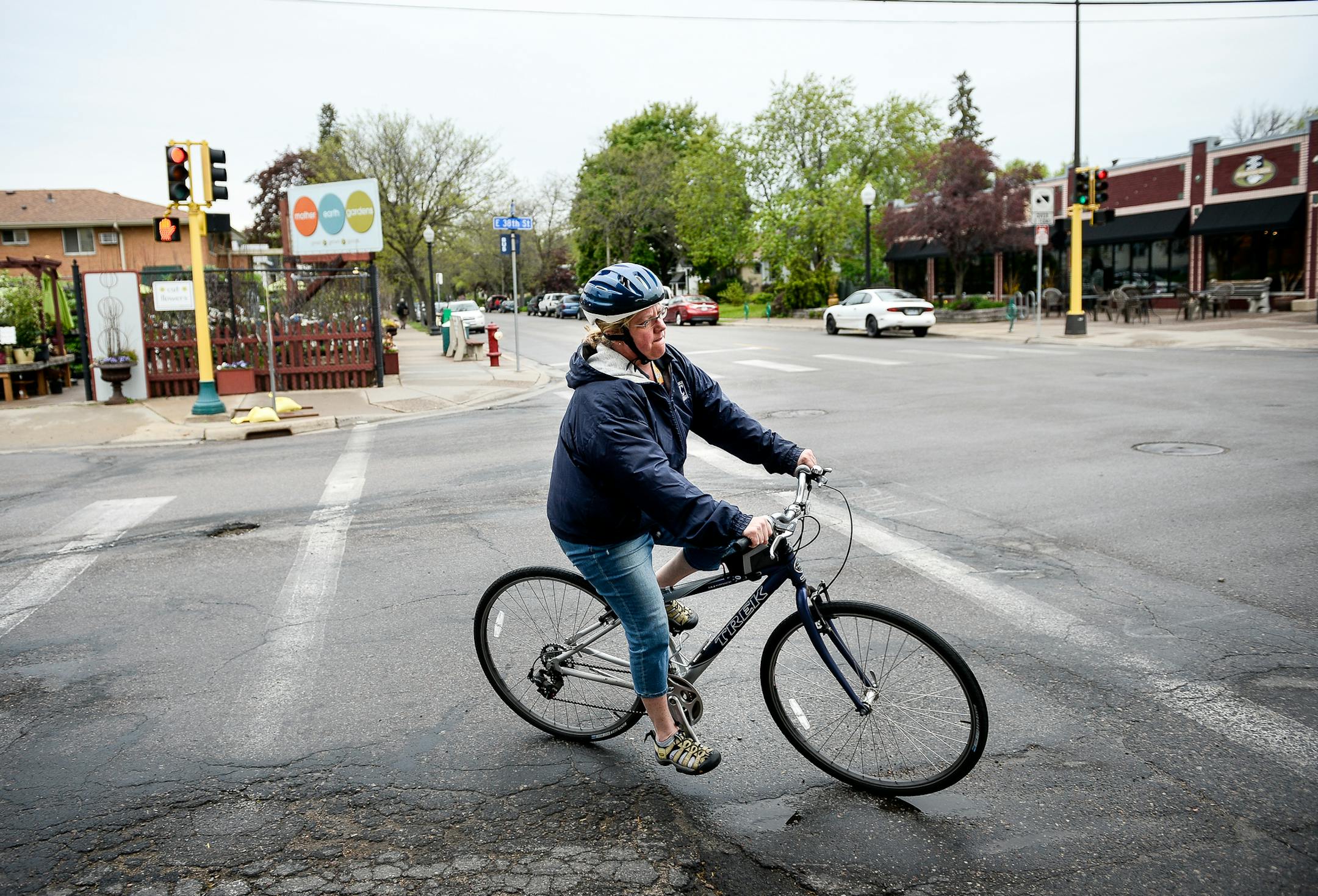 Andrea Hansen, of Longfellow, turned onto 42nd Avenue South from 38th Street on her way to meet with her son as he was let out of school at Hiawatha Elementary School Wednesday afternoon. "I think it's a good idea (to add bike lanes) but I'm also good friends with some of the business owners, so I understand their frustration," Hansen said. But, "anything we can do to make our neighborhoods more rideable and walkable is important." ] AARON LAVINSKY ï aaron.lavinsky@startribune.com Longfello