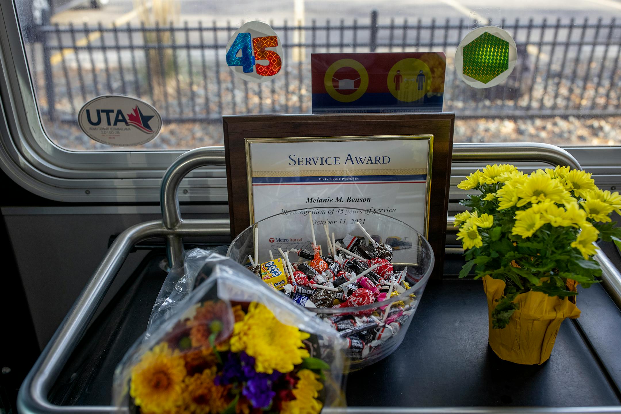 Transit employees greeted Melanie Benson with flowers and a plaque at one of her stops celebrating her anniversary, Monday, October 11, 2021 between Minneapolis and St. Paul.