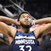 Minnesota Timberwolves center Karl-Anthony Towns (32) reacts to being called on a foul during overtime.