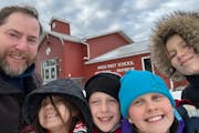 With four students in a one-room school house for grades K-6, teacher Allen Edman, left, is joined by Alessa Mallett, Rob Shoen, Alyssa Johnson and Ha