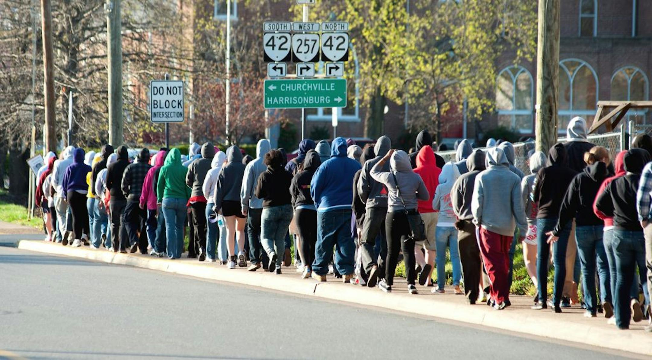 In a Monday, March 26, 2012 photo, Bridgewater College students and others march down Dinkel Avenue in Bridgewater, Va., to the 7-Eleven where several students bought Skittles and ice tea during a protest of the shooting death of Trayvon Martin, a teenager from Florida, who was shot and killed by a man acting as a neighborhood watchman.