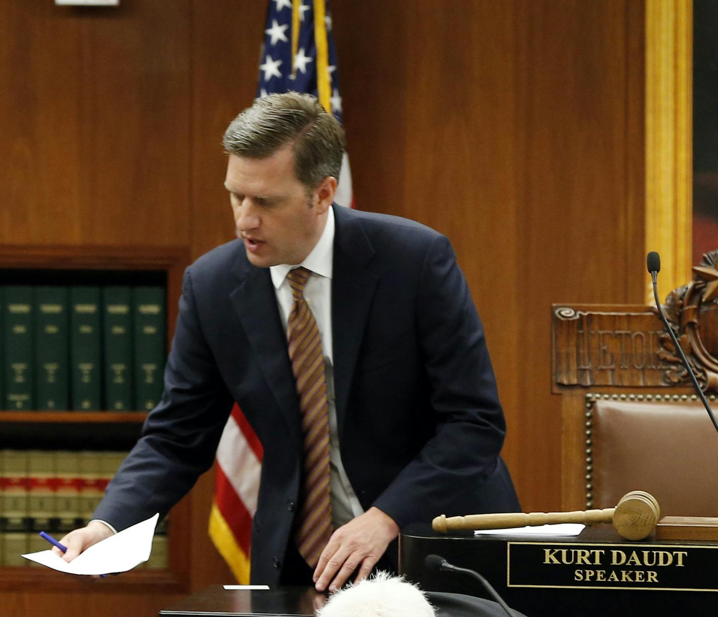 A smaller portrait of Abe Lincoln hangs behind House Speaker Kurt Daudt, center, in a hearing room where Minnesota House members met for a special session of the Minnesota Legislature, Friday, June 12, 2015, in St. Paul, Minn. The State Capitol is under renovation, requiring the move to the temporary meeting rooms in the State Office Building. (AP Photo/Jim Mone)