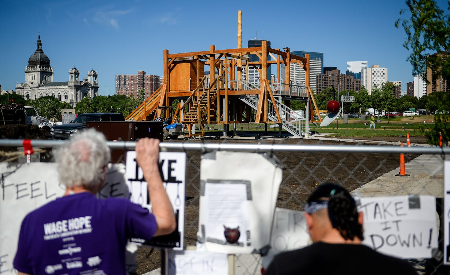 Patrick Greffin, of Minneapolis, left, and Virgil Blacklance, from the Lower Sioux Reservatino, visited the site of a protest near Sam Durant's "Scaffold" sculpture. ] AARON LAVINSKY &#xef; aaron.lavinsky@startribune.com A group of Dakota tribal elders met Wednesday with officials from the Walker Art Center and the Minneapolis Park Board to discuss the controversial "Scaffold" sculpture. We photograph a press conference after the meeting on Wednesday, May 31, 2017 at the Walker Art Center in Min