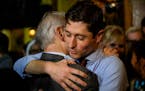 Incumbent Minneapolis Mayor Jacob Frey hugged his father at an election night party on Tuesday.